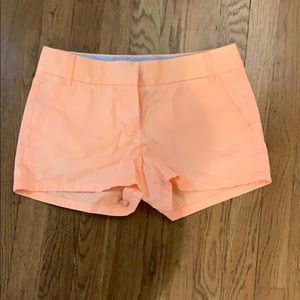 Bright peach colored shorts